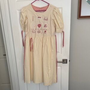 Elegant Cream Midi Dress with Pink Details